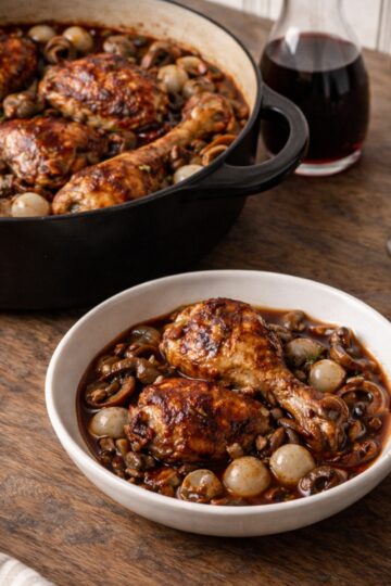 Authentic Coq au Vin recipe with chicken braised in Burgundy wine, lardons, mushrooms, and pearl onions. Classic French technique, step by step.