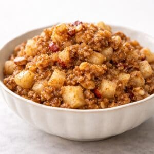 bowl of apple walnut charoset, on photo board