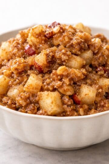 bowl of apple walnut charoset, on photo board