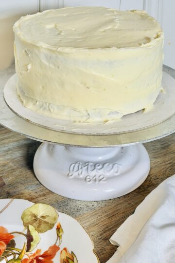 Carrot Cake on a pedistal with cream cheese frosting